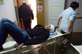 Injured man arrives in hospital after shelling in Donetsk