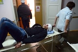 Injured man arrives in hospital after shelling in Donetsk