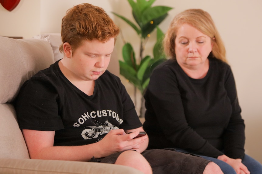 Karen Kennedy sits with her son Aaron Kennedy.