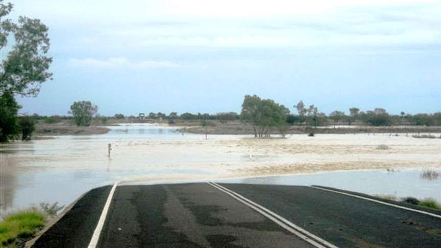 File photo of flooded Flinders Highway near Richmond in north-west Qld in January 2009.