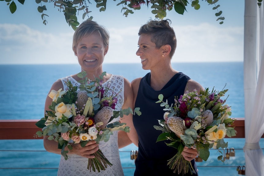 Zoe Nolan and Michelle Edwards pose on their wedding day.