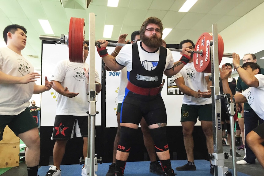 Powerlifter Anthony Krznar doing a squat.