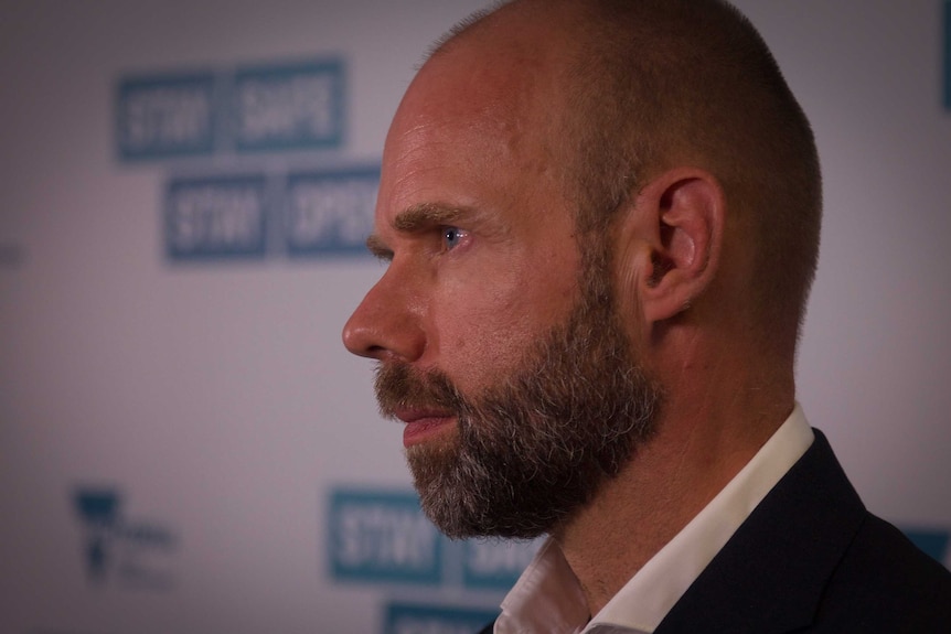 A close up of Jeroen Weimar speaking at a press conference.