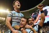 Edge of history ... The Sharks celebrate during their preliminary final victory over the Cowboys