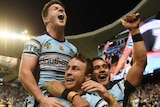 Cronulla celebrates a James Maloney try