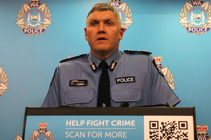 A head and shoulders shot of a WA police officer with short grey hair.