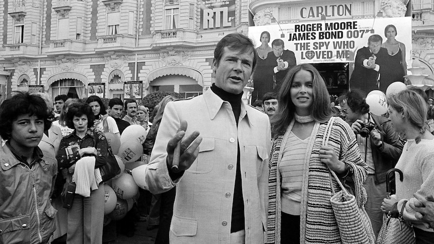 Roger Moore and Barbara Bach arrive for the screening of their feature, The Spy Who Loved Me, in France in 1977.