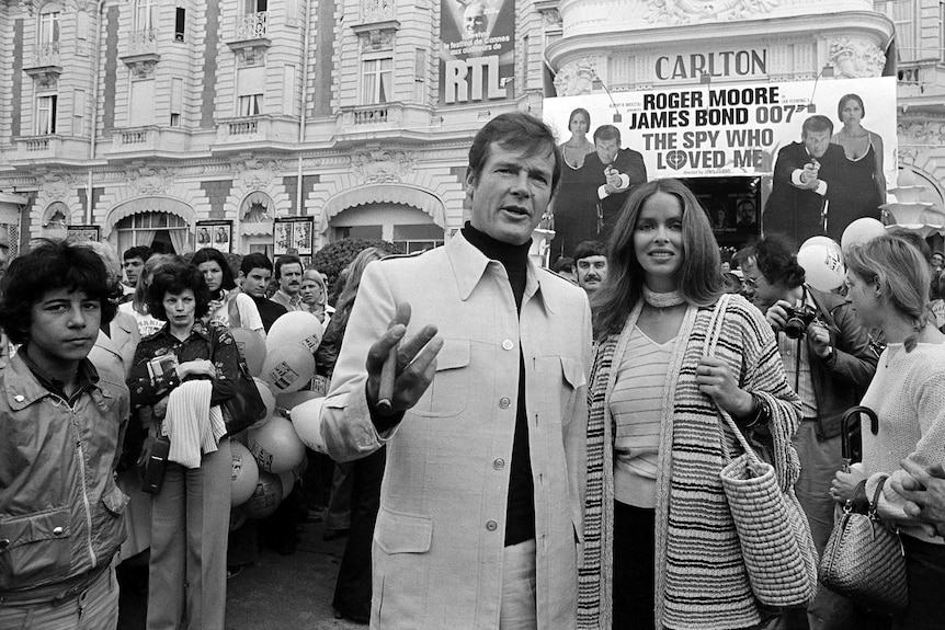 Roger Moore and Barbara Bach arrive for the screening of their feature, The Spy Who Loved Me, in France in 1977.