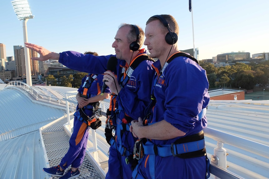 Gerard Whateley and Chris Rogers on the Adelaide Oval roof