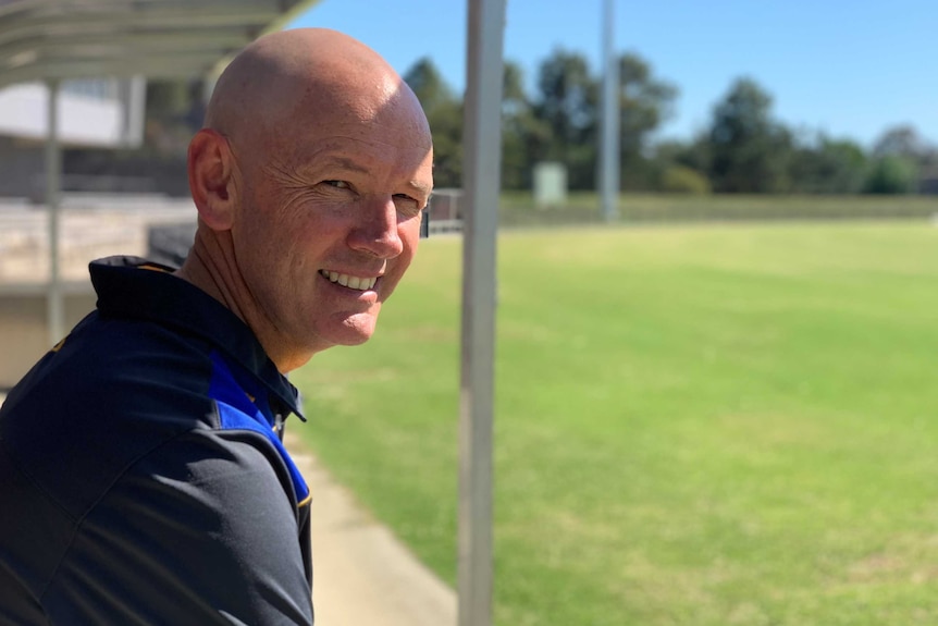 ACT Meteors coach David Drew staring out at the field.