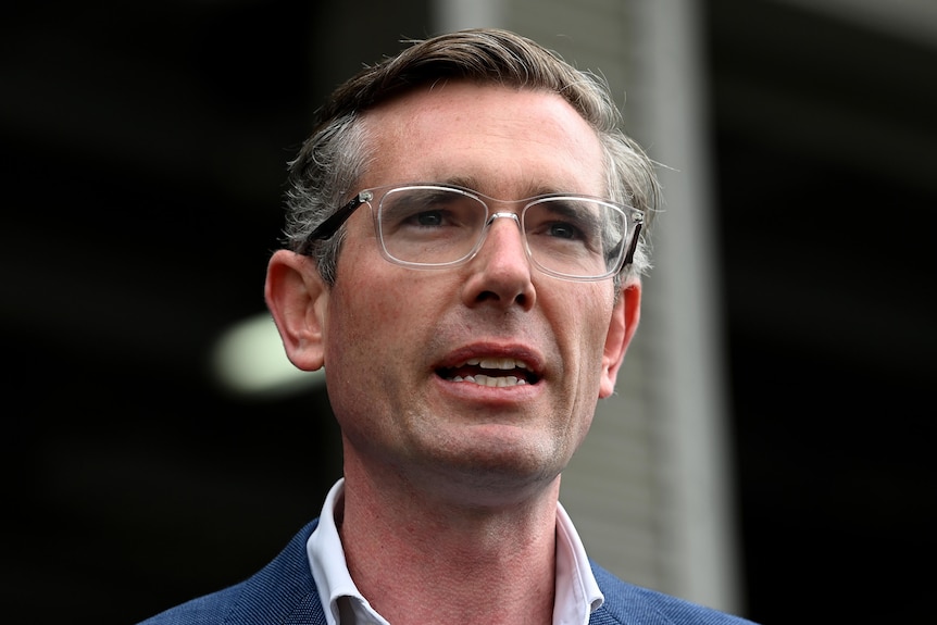 Close-up shot of man wearing glasses speaking.