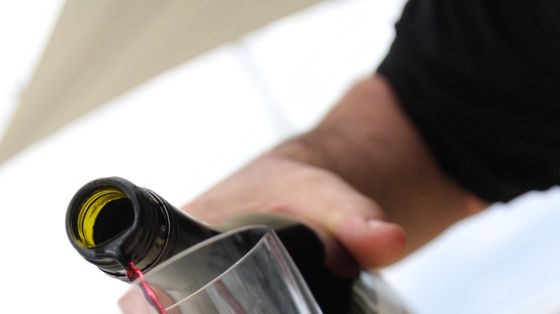 Wine is poured into a glass