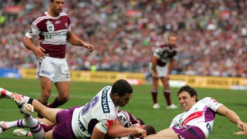 Greg Inglis and Billy Slater try to stop Matt Ballin from scoring a try during the NRL grand final