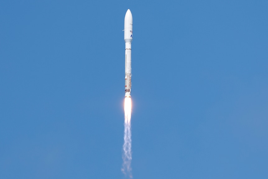 Atlas V rocket in the distance after lift-off