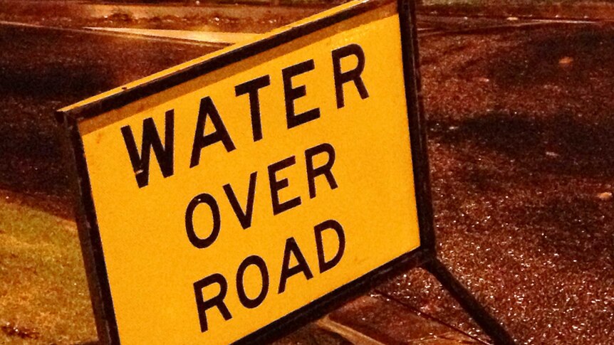 Water over road sign at Traralgon