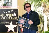 Paul McCartney steps out on his newly unveiled star on the Hollywood walk of fame