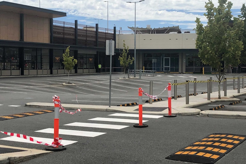 A shopping centre car park where concrete has collapsed.