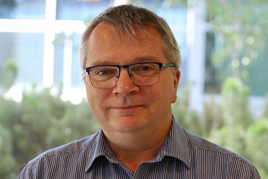 A profile shot of Anglicare WA chief executive Mark Glasson posing for a photo.