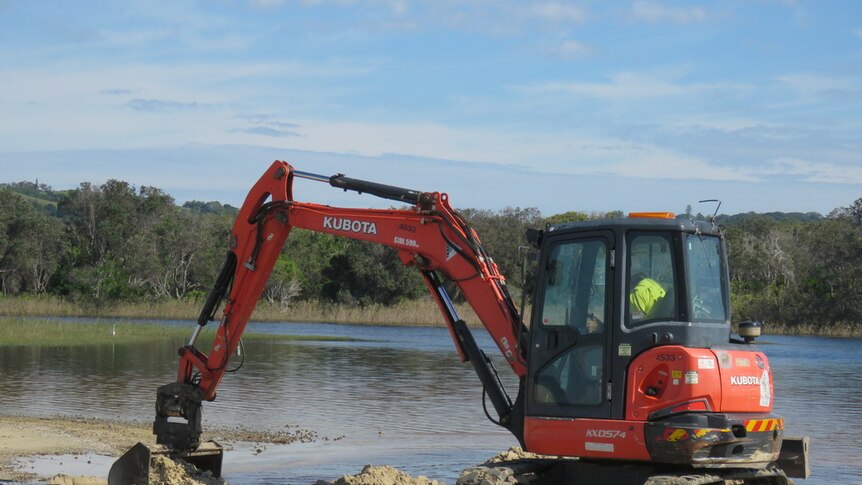 Heavy machinery clears a sand bank at Tallow Creek
