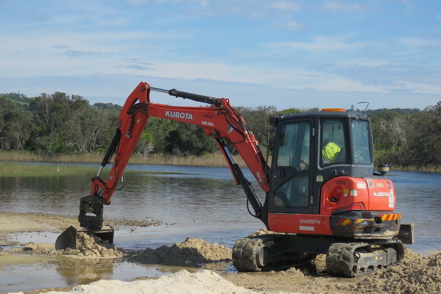 Heavy machinery clears a sand bank at Tallow Creek