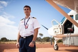 Chartair pilot Harvey Salameh stands in front of his plane in remote WA.