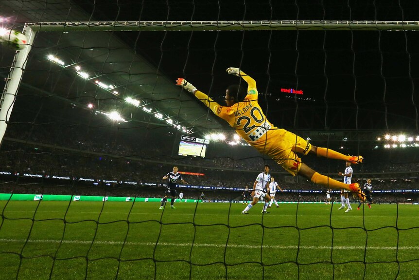 Melbourne City goalkeeper Tando Velaphi beaten by a shot from Victory's Kosta Barbarouses.
