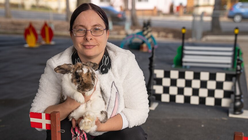 Rabbit hopper Catherine Naismith holding rabbit.