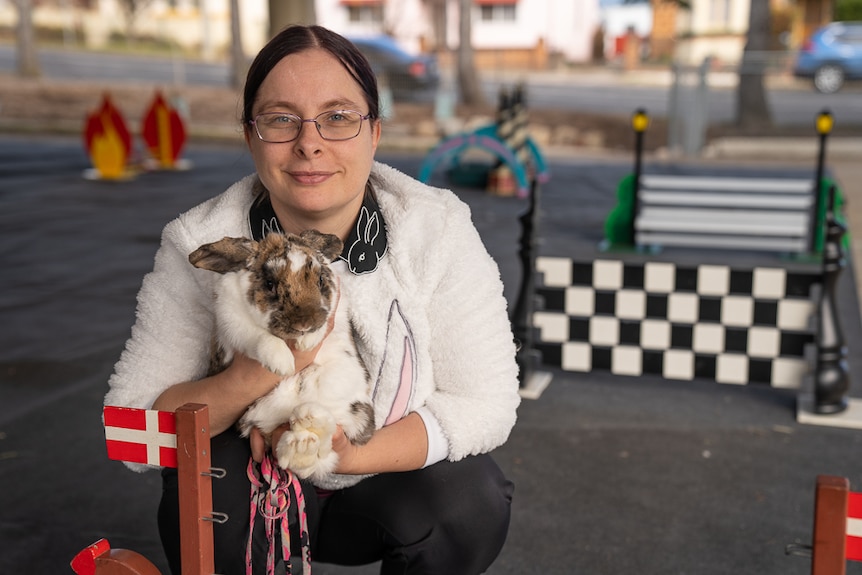 Rabbit hopper Catherine Naismith holding rabbit.