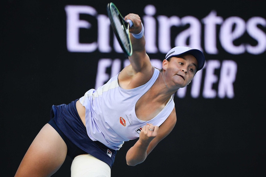 Ash Barty serves to Ekaterina Alexandrova at the Australian Open.