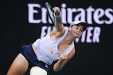 Ash Barty serves to Ekaterina Alexandrova at the Australian Open.
