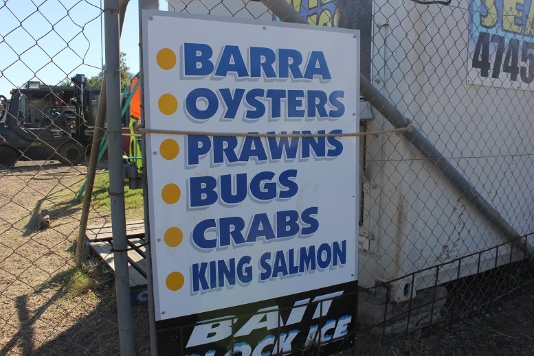 A board outside a fish van advertising seafood