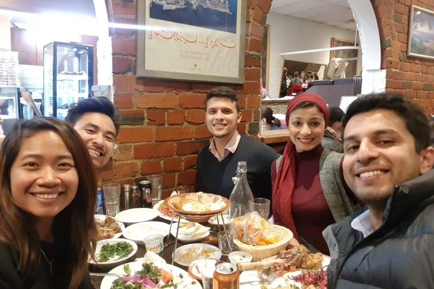 Lina Breik (second from right) eating with friends during Ramadan.