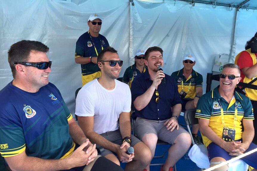 Ian Thorpe chats with a few members of the Australian team