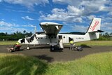A small plane is loaded up on an outer island in Vanuatu.