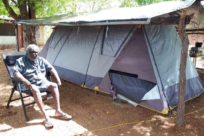 Djambawa Marawili AM outside his tent-house house at Baniyala in December 2020