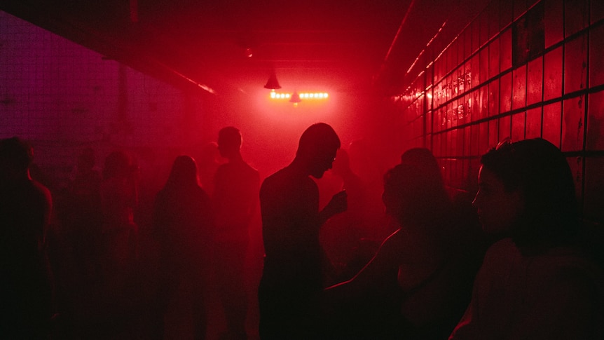People at a dark nightclub.