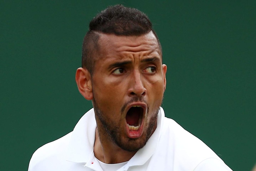 A close-up of Nick Kyrgios's face as he shouts angrily.