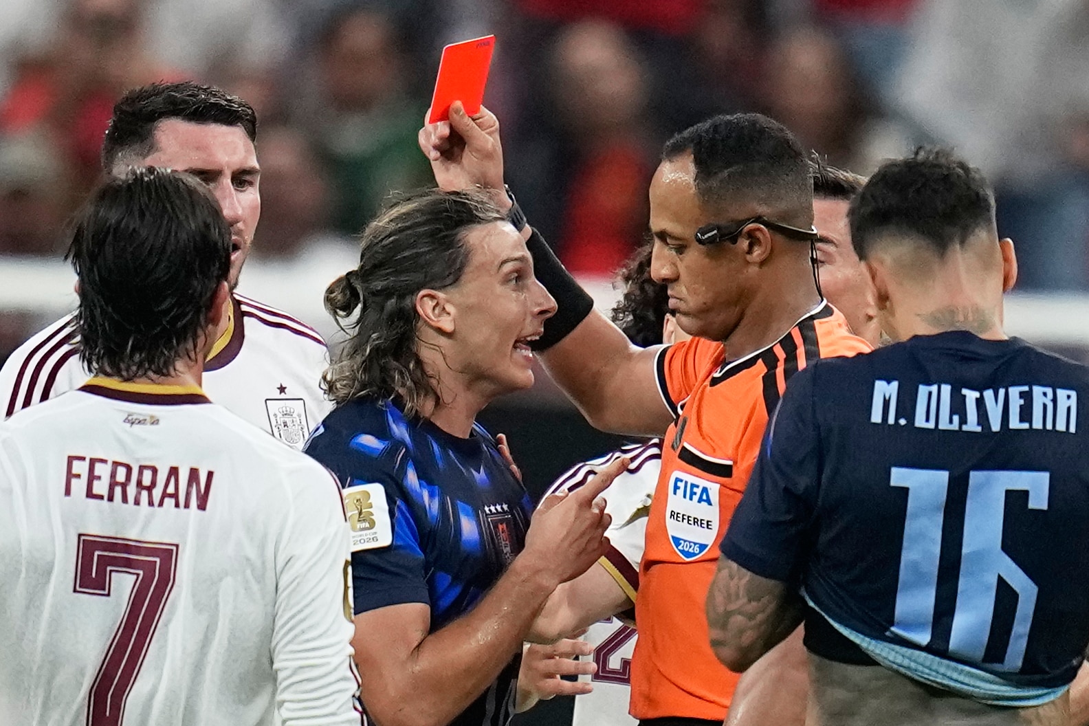 Agustin Canobbio gets into the referee's face as he is shown a red card