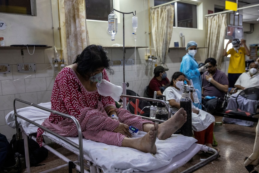 A patient suffering from the coronavirus disease (COVID-19) receives treatment.