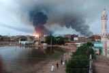 Smoke rises over buildings in Khartoum, Sudan