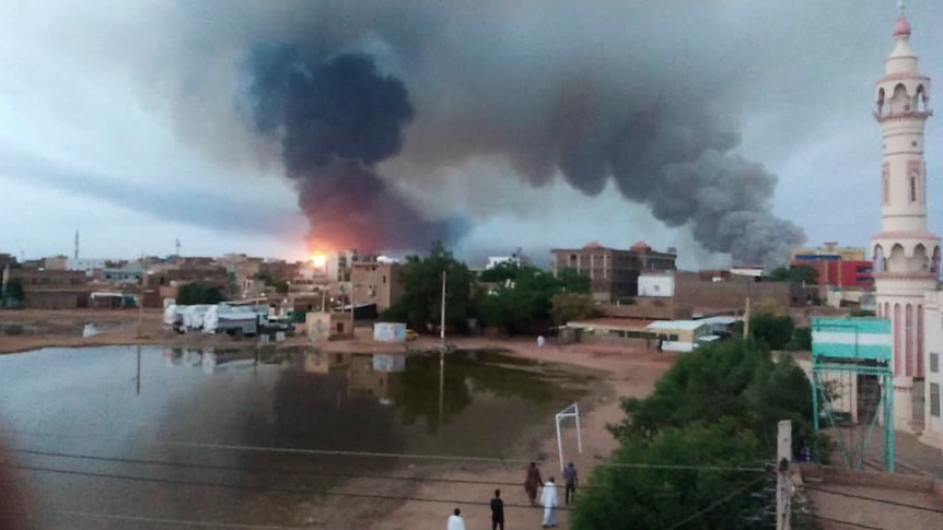 Smoke rises over buildings in Khartoum, Sudan