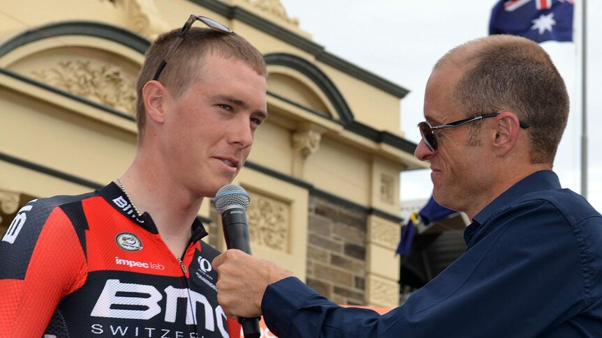 Cyclist Rohan Dennis speaks to the media before stage one.