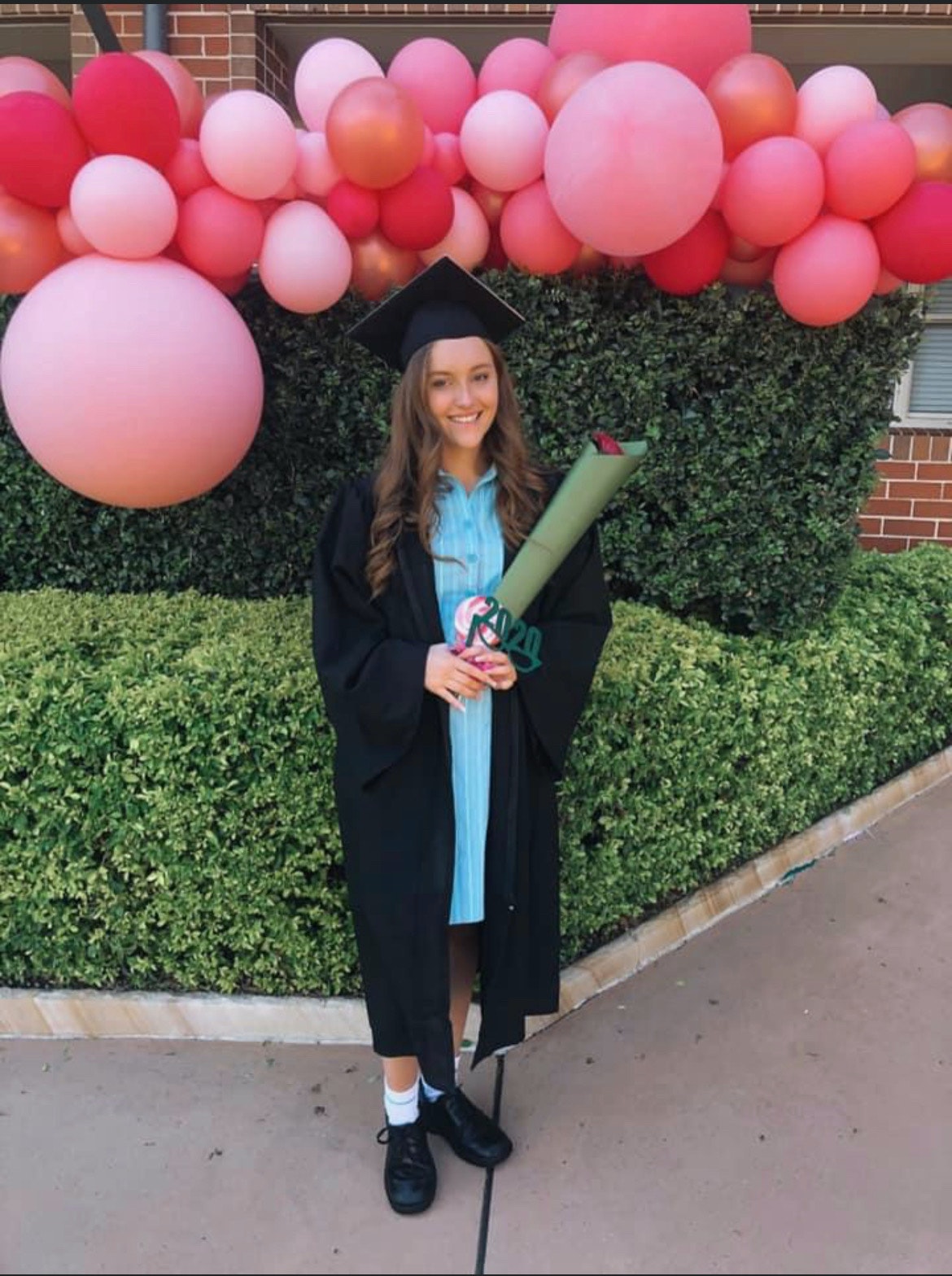 Lilie James, who was found dead at St Andrew's Cathedral School on October 25, 2023, in 2020 in graduation outfit and hat