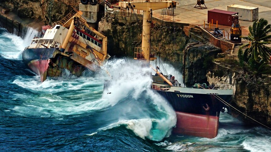 Waves batter the phosphate carrier MV Tycoon On Christmas Island.