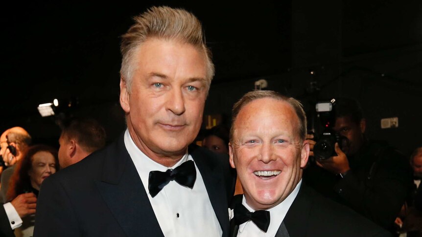 Alec Baldwin and Sean Spicer wear tuxedos on the red carpet stage at the 69th Primetime Emmy Awards.