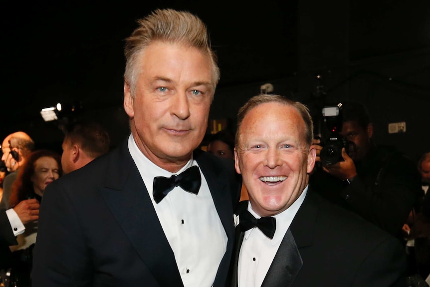 Alec Baldwin and Sean Spicer wear tuxedos on the red carpet stage at the 69th Primetime Emmy Awards.