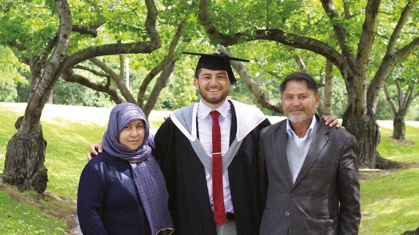 Abbas Nazari with his parents after graduating