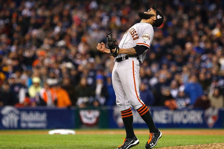 San Francisco Giants relief pitcher Sergio Romo celebrates after the Giants win the World Series.