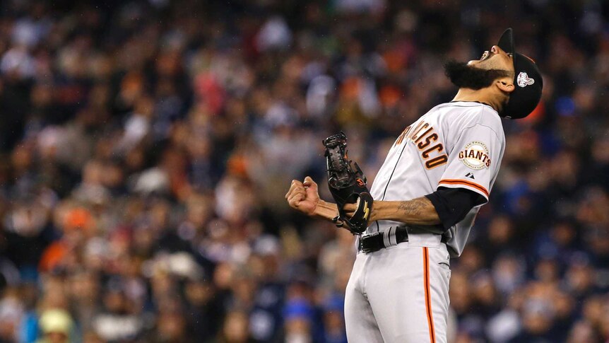 San Francisco Giants relief pitcher Sergio Romo celebrates after the Giants win the World Series.