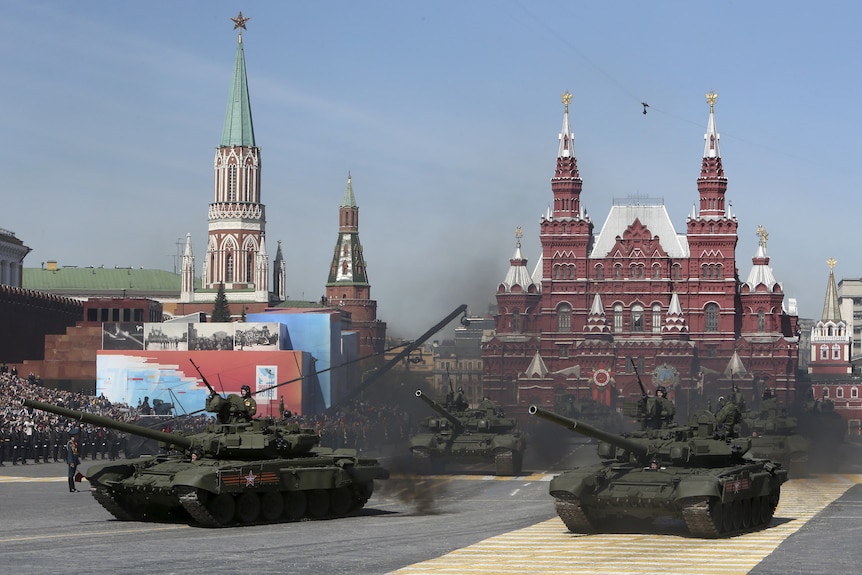 Russian servicemen drive T-90 tanks during a rehearsal for the Victory Day parade in Red Square in central Moscow.